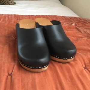 genuine black leather and wood clogs.